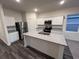 Modern kitchen with granite countertops, stainless steel appliances, and white cabinetry at 620 Muster Field Ct., Conway, SC 29526