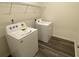 Practical laundry room with washer, dryer, and shelving at 620 Muster Field Ct., Conway, SC 29526