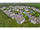 Aerial view of a condo complex with a lake, community pool, and lots of parking at 6253 Catalina Dr. # 433, North Myrtle Beach, SC 29582