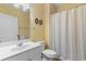 Clean bathroom features a single sink vanity, toilet, shower with curtain, and a linen closet at 6253 Catalina Dr. # 433, North Myrtle Beach, SC 29582