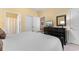 Charming bedroom with a TV on a dresser, and views through doorway into the cozy living room at 6253 Catalina Dr. # 433, North Myrtle Beach, SC 29582