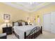 Inviting bedroom features neutral walls, tray ceiling, ample natural light and adjoins a bathroom and closet at 6253 Catalina Dr. # 433, North Myrtle Beach, SC 29582