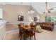 Open-concept living space with a dining table and cozy sofa at 6253 Catalina Dr. # 433, North Myrtle Beach, SC 29582
