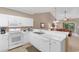 Bright kitchen features white appliances and a cozy breakfast bar at 6253 Catalina Dr. # 433, North Myrtle Beach, SC 29582
