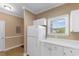 Bright kitchen corner shows cabinets, counter and a refrigerator at 6253 Catalina Dr. # 433, North Myrtle Beach, SC 29582