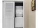 Stacked washer and dryer unit in a closet with white doors at 6253 Catalina Dr. # 433, North Myrtle Beach, SC 29582