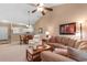 Relaxing living room with plush seating, ceiling fan, and an adjacent dining area and partial view to the kitchen at 6253 Catalina Dr. # 433, North Myrtle Beach, SC 29582