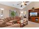 Inviting living room features a ceiling fan, comfortable sofa, and access to a private balcony with scenic views at 6253 Catalina Dr. # 433, North Myrtle Beach, SC 29582