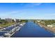 A marina with boats docked on a sunny day with oceanfront condos in the background at 6253 Catalina Dr. # 433, North Myrtle Beach, SC 29582