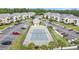 Aerial view of tennis court surrounded by condos and ample parking, showcasing the community layout at 637 Waterway Village Blvd. # 13C, Myrtle Beach, SC 29579