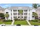 Aerial view of a charming condo building with private balconies and lush landscaping on a sunny day at 637 Waterway Village Blvd. # 13C, Myrtle Beach, SC 29579