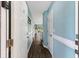 Inviting hallway featuring wood-look floors and soothing, light blue walls, leading to the main living areas at 637 Waterway Village Blvd. # 13C, Myrtle Beach, SC 29579