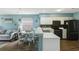 Bright, eat-in kitchen with an adjacent dining area, featuring white cabinets and modern black appliances at 637 Waterway Village Blvd. # 13C, Myrtle Beach, SC 29579