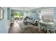 Bright living room with modern decor, sliding glass doors to patio, and stylish furnishings at 637 Waterway Village Blvd. # 13C, Myrtle Beach, SC 29579