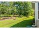 Expansive backyard featuring lush greenery and mature trees, creating a serene outdoor space at 6478 Royal Pine Dr., Myrtle Beach, SC 29588