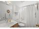Neutral bathroom with a vanity, mirror, toilet, and a shower with a white curtain at 6478 Royal Pine Dr., Myrtle Beach, SC 29588