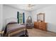 Cozy bedroom with warm wood-look flooring and neutral tones, creating a relaxing retreat at 6478 Royal Pine Dr., Myrtle Beach, SC 29588