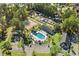 Aerial view showcasing a community pool and recreational amenities with tennis courts and playground at 6478 Royal Pine Dr., Myrtle Beach, SC 29588