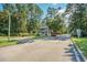 Gated community entrance with well-maintained landscaping and a security booth for added peace of mind at 6478 Royal Pine Dr., Myrtle Beach, SC 29588