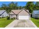 Charming one-story home boasts a manicured lawn, attached two-car garage, and mature landscaping at 6478 Royal Pine Dr., Myrtle Beach, SC 29588