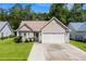 Charming single-story home with a well-maintained lawn and a two-car garage at 6478 Royal Pine Dr., Myrtle Beach, SC 29588