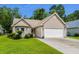 Well-kept single-story home features a spacious driveway and manicured landscaping at 6478 Royal Pine Dr., Myrtle Beach, SC 29588