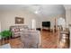 Spacious living room with hardwood floors, comfortable seating, and a neutral color palette at 6478 Royal Pine Dr., Myrtle Beach, SC 29588