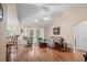 Open-concept living room with vaulted ceilings, hardwood floors, and backyard access at 6478 Royal Pine Dr., Myrtle Beach, SC 29588