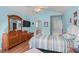 Bright main bedroom with a vaulted ceiling, adjoining bathroom, and wood-look floors at 6478 Royal Pine Dr., Myrtle Beach, SC 29588