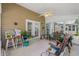 Covered sunroom with a variety of seating options at 6478 Royal Pine Dr., Myrtle Beach, SC 29588