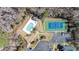 Aerial view of community pool and tennis court in wooded location at 664 Tupelo Ln. # 8A, Longs, SC 29568