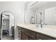 Bright bathroom vanity with a large mirror and view into the bedroom at 664 Tupelo Ln. # 8A, Longs, SC 29568