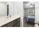 Well-lit bathroom featuring a modern vanity with a white countertop and dark wood cabinetry at 664 Tupelo Ln. # 8A, Longs, SC 29568