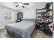 Bedroom featuring hardwood floors, ceiling fan, and a comfortable bed with decor at 664 Tupelo Ln. # 8A, Longs, SC 29568