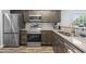 Updated kitchen with stainless steel appliances, granite countertops, and warm wood cabinets at 664 Tupelo Ln. # 8A, Longs, SC 29568