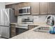 Well-equipped kitchen featuring stainless steel appliances and granite countertops at 664 Tupelo Ln. # 8A, Longs, SC 29568