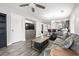 Bright living room with wood floors, modern furniture, and sliding barn door at 664 Tupelo Ln. # 8A, Longs, SC 29568