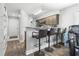 Open concept living area featuring bar seating and a view of the kitchen, dining room, and front door at 664 Tupelo Ln. # 8A, Longs, SC 29568
