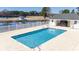 Gorgeous pool surrounded by lush landscaping and a view of the water at 664 Tupelo Ln. # 8A, Longs, SC 29568
