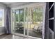 Relaxing screened porch with comfortable seating and view of the backyard at 664 Tupelo Ln. # 8A, Longs, SC 29568