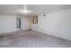 Basement featuring wood paneling, access to another room, and neutral colored carpet at 704 N North Congdon St., Georgetown, SC 29440