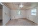 Basement featuring wood paneling, a window, and neutral colored carpet at 704 N North Congdon St., Georgetown, SC 29440