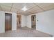 Basement featuring wood paneling, access to multiple rooms, and neutral colored carpet at 704 N North Congdon St., Georgetown, SC 29440
