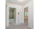 Hallway with neutral carpet featuring access to multiple rooms and an old telephone at 704 N North Congdon St., Georgetown, SC 29440