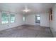 View of living room with wall paneling and windows for natural light at 704 N North Congdon St., Georgetown, SC 29440