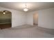 Living room with neutral colored carpet and view into dining and entry areas at 704 N North Congdon St., Georgetown, SC 29440