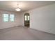 Bright living room features neutral carpet and an open view to the entry and dining areas at 704 N North Congdon St., Georgetown, SC 29440