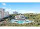 Aerial view of a resort with a pool, cabanas, and ocean views at 7253 Seville Dr., Myrtle Beach, SC 29572