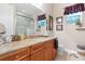 Bright bathroom with vanity and granite countertop and a shower at 7253 Seville Dr., Myrtle Beach, SC 29572
