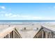 Beach access with boardwalk stairs leading to the ocean at 7253 Seville Dr., Myrtle Beach, SC 29572